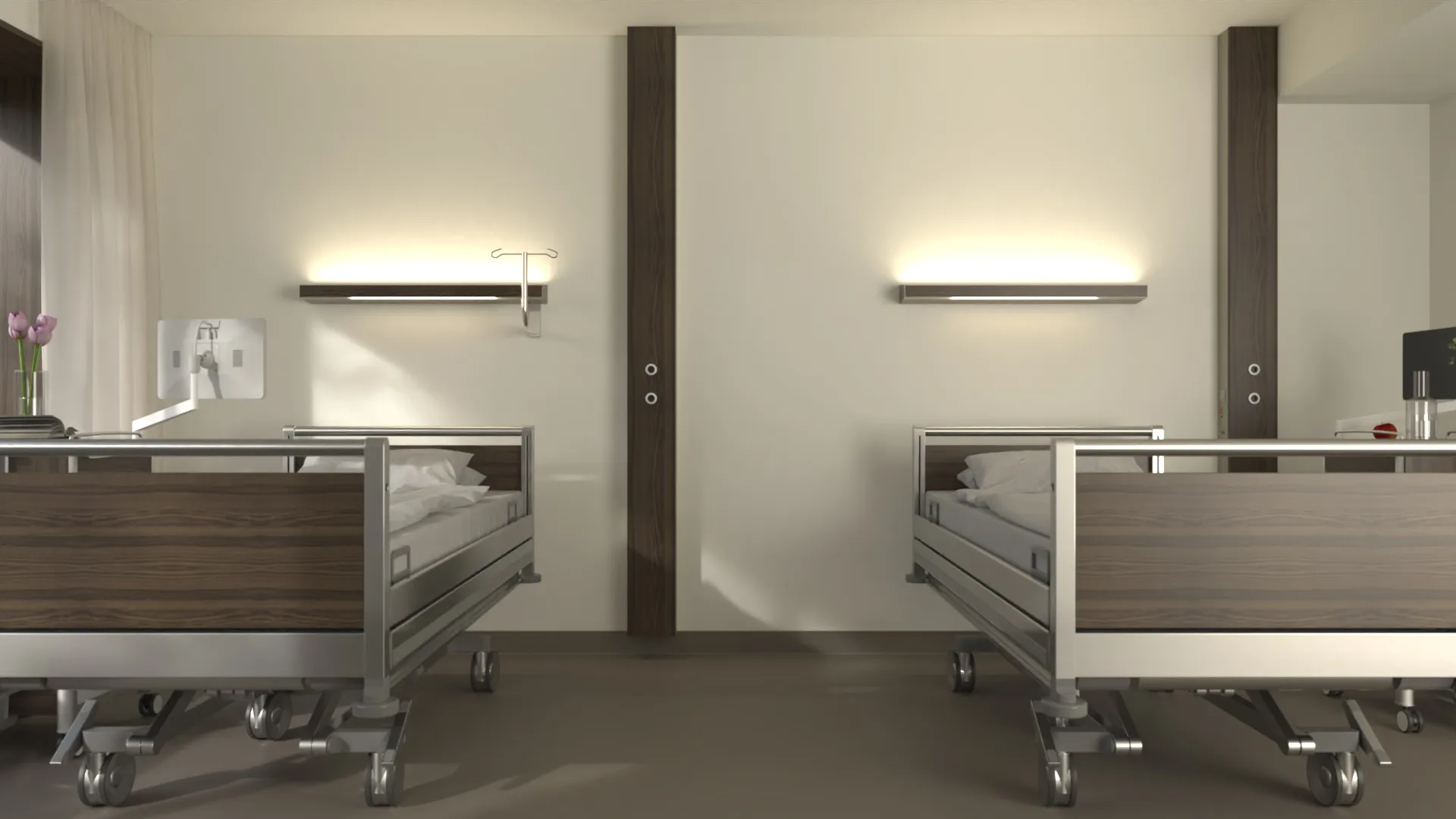 Two hospital beds with wood panelling stand side by side in a bright room with wall lamps and medical accessories